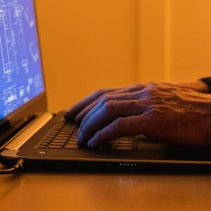 Person using a laptop for remote IT support